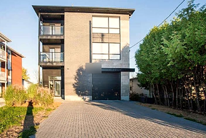 Front exterior of a sold modern low-rise building